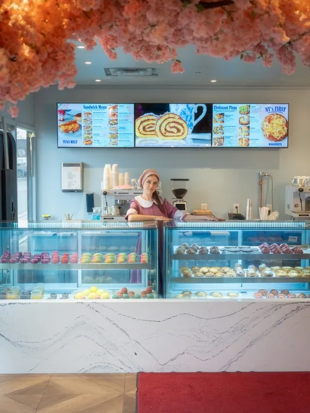 The pastry case at Lakewood, rows of croissants and cakes